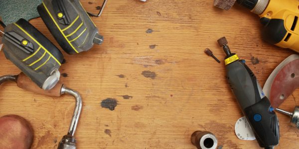 handyman tools lying around on wood floor
