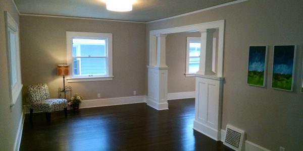 home remodeling project with gray walls, white built ins and trim, and ebony stained hardwood floors