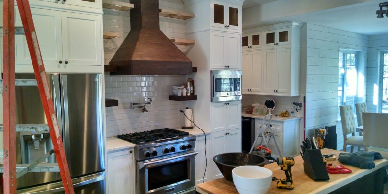 Rustic modern kitchen renovation, white cabinets under construction