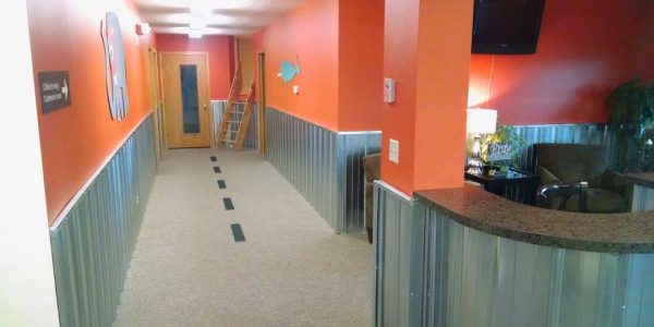River of Life Children's Wing Hallway Renovation Orange Walls and Corrugated Steel panels
