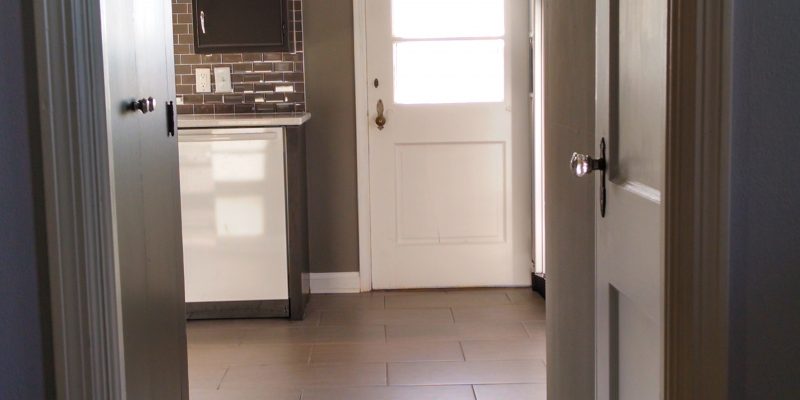 kitchen entryway remodel with subway tile floor and subway tile backsplash